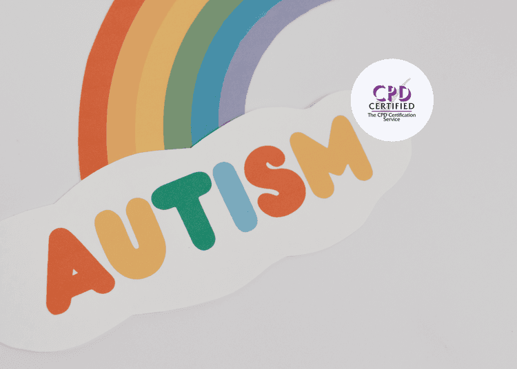 A paper rainbow with red, orange, yellow, green, blue, and purple stripes ending in a cloud reading “AUTISM”.