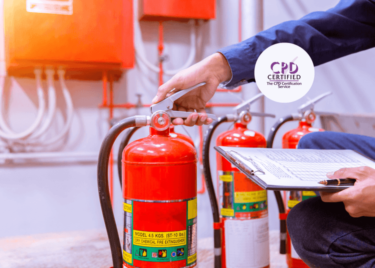 A person checking the pressure gauge of a red fire extinguisher while holding a clipboard during a fire safety inspection.
