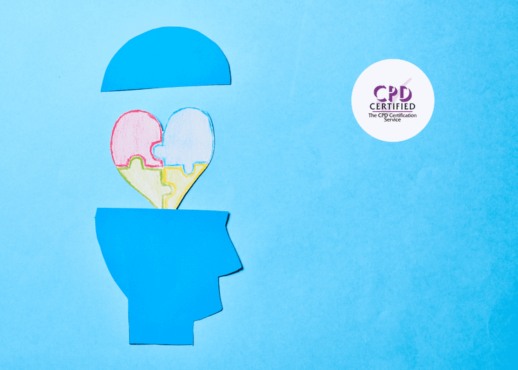 Blue paper cut-out of a human head with the top lifted, revealing a multicoloured heart made of puzzle pieces inside.