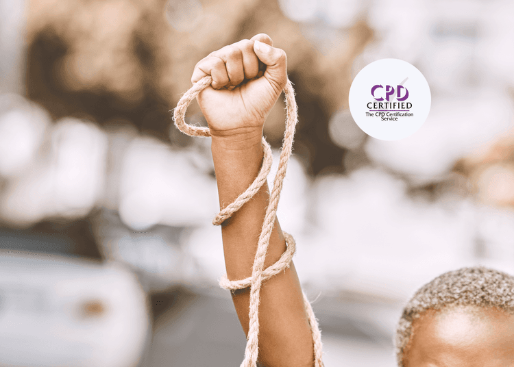 Raised fist wrapped loosely in coarse rope, with blurred urban background and partial view of a person's head below.