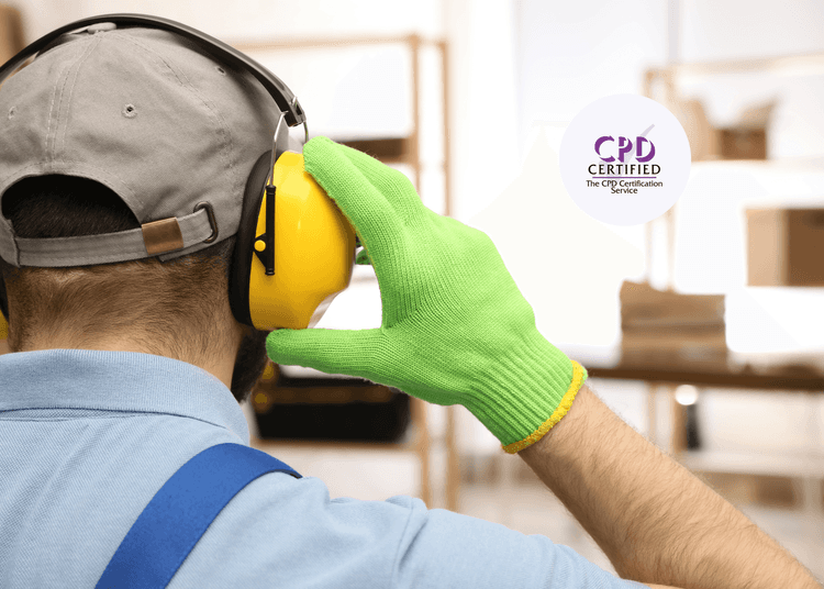 Worker wearing bright yellow noise protective headphones with a bright green gloves for safety.
