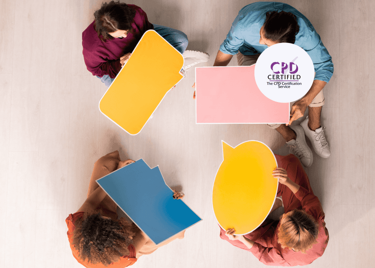 Overhead view of five people seated in a circle holding colourful blank speech bubble signs.