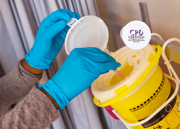 Hands wearing blue gloves placing a used medical syringe into a yellow clinical sharps bin.