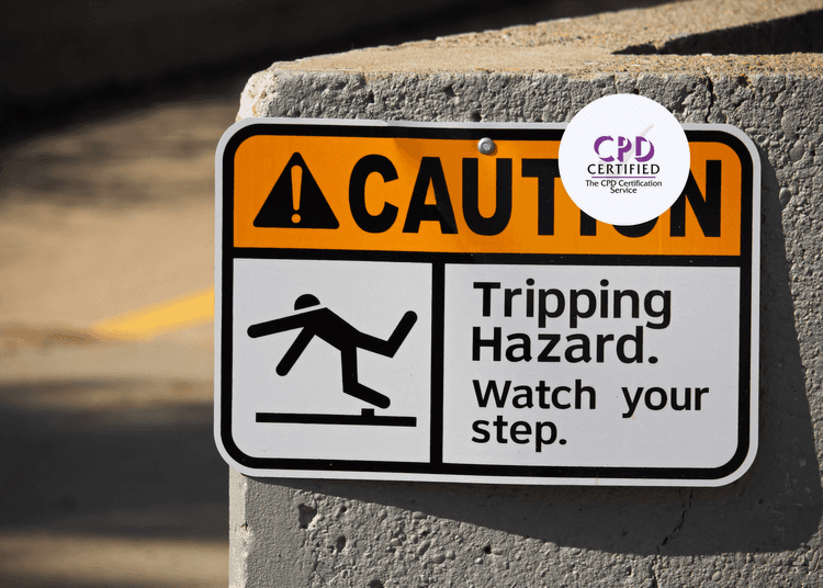 Caution sign displaying the text "Tripping Hazard. Watch your step." With an image of a falling person.