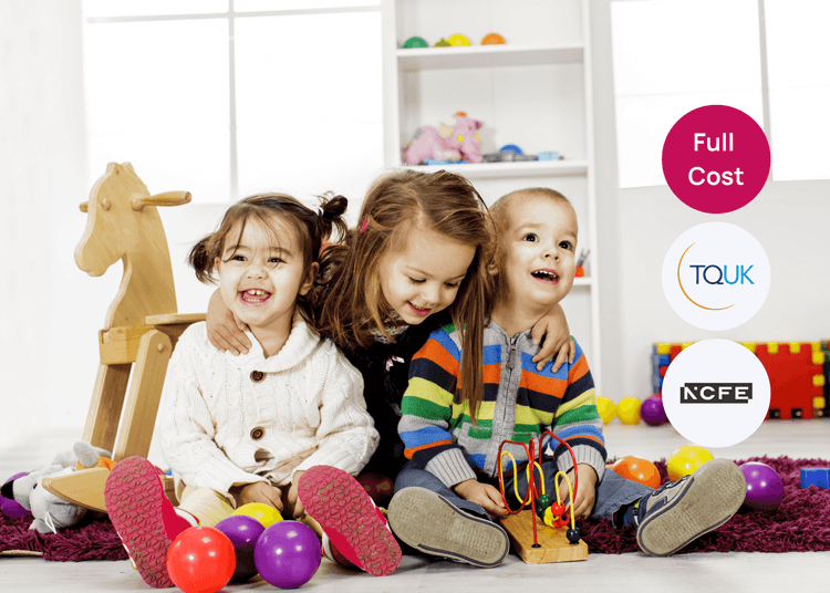 Three young children sitting on the floor playing with toys in a bright early years setting.