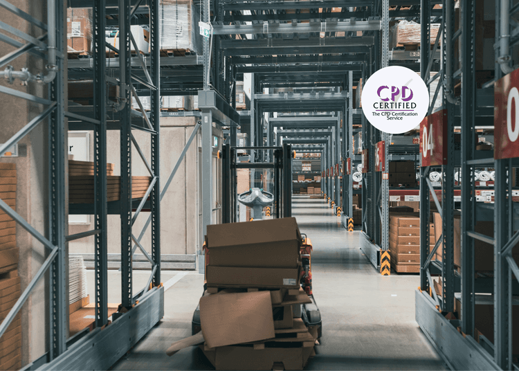 Warehouse aisle with storage racks, stacked goods and equipment.