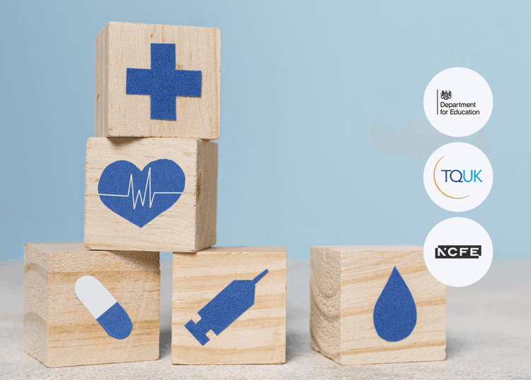Five wooden blocks showing blue healthcare icons like a heart, pill, syringe, and droplet, stacked on a light surface.