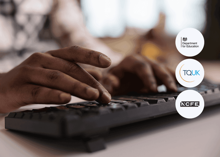 Close-up of hands typing on a black computer keyboard with a blurred indoor background and natural lighting.