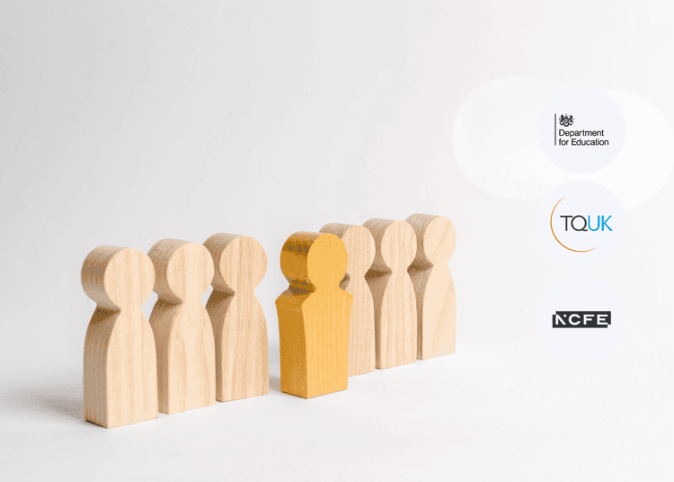 Eight wooden figurines standing in a line on a white background, with one painted yellow to stand out from the group.