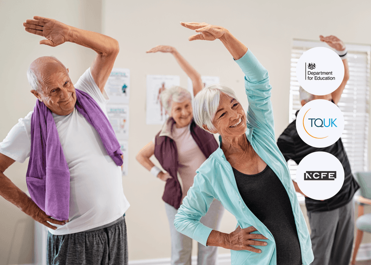 Group of older adults in activewear performing side stretches in a bright room, smiling and following an exercise routine.