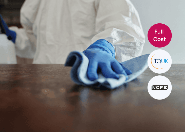 Gloved hand cleaning a surface, reflecting safe hygiene practices taught in infection control training. Person in protective clothing wiping a surface with a blue cloth, suitable for infection control or cleaning training.