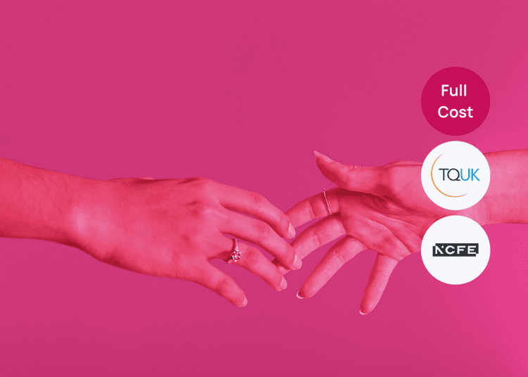 Hands reaching together, reflecting themes of support and connection relevant to safeguarding training. Two hands reaching toward each other against a pink background, with visible rings on both hands.