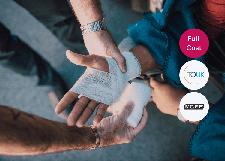 Bandaging an injured wrist, showing practical first aid skills useful for health and safety training. Hands wrapping a bandage around an injured wrist, with gauze being secured during first aid treatment.