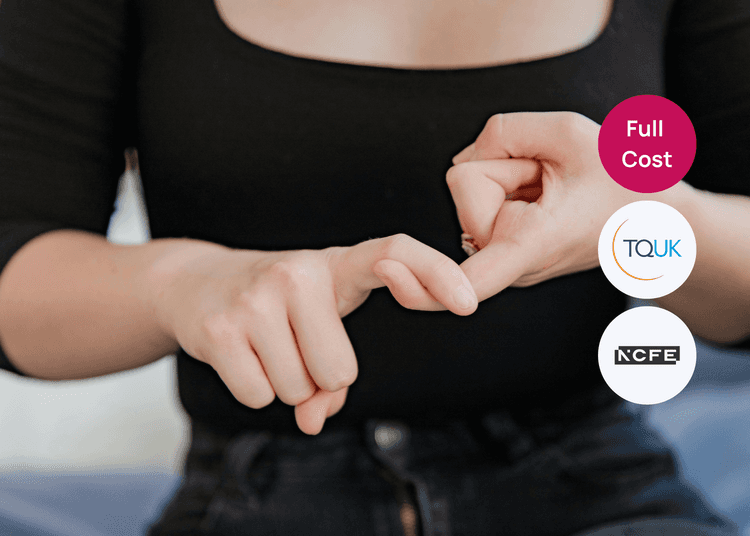 Hands demonstrating a gesture often used in sign language, suitable for communication and accessibility training. Hands forming a sign with fingers against a blurred background, representing communication used in sign language training.