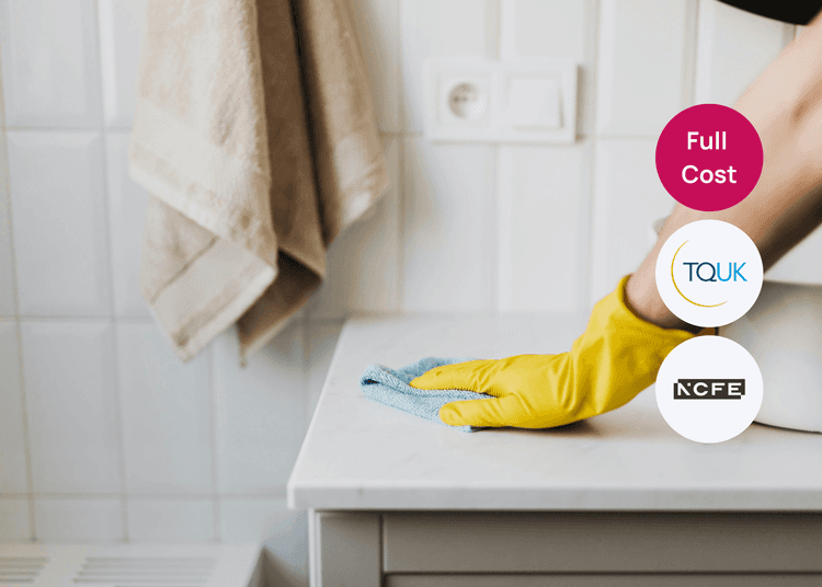 Wiping down a bathroom surface with gloves and a cloth, showing safe and effective cleaning practice. Person wearing yellow gloves wiping a bathroom surface with a cloth during cleaning tasks.