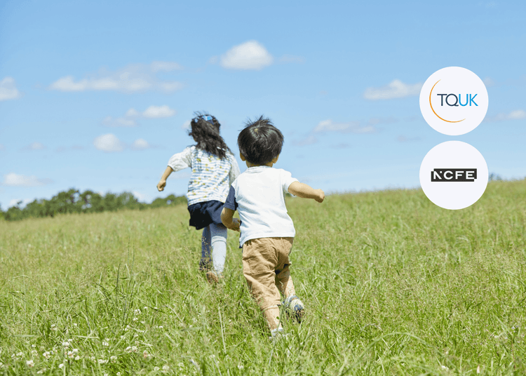Two children playing outdoors, representing the focus of the Behaviour That Challenges course on understanding and supporting children’s complex behaviours. Two young children running through a grassy field under a bright blue sky beside TQUK and NCFE logos, symbolising learning and growth.