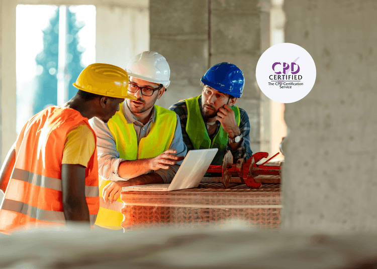 Builders discuss the Health & Safety aspects in a construction environment while working on an active building site. Three builders in different coloured hard hats discuss construction and Health & Safety plans on a building site.