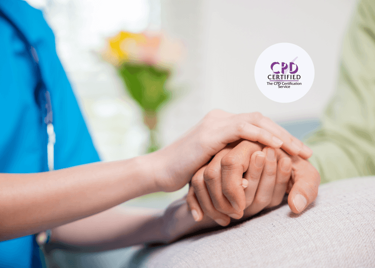 Supportive care is central to understanding the Mental Capacity Act and protecting patients’ rights in medical settings. Nurse in blue uniform gently holds a patient's hand on a hospital bed, with flowers blurred in the background.