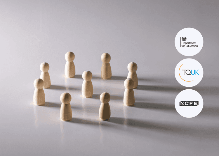 Wooden figures arranged in a circle on a smooth surface, linking to group dynamics in safeguarding and British values. Nine plain wooden figurines standing in a loose circle on a reflective surface under soft, directional lighting.