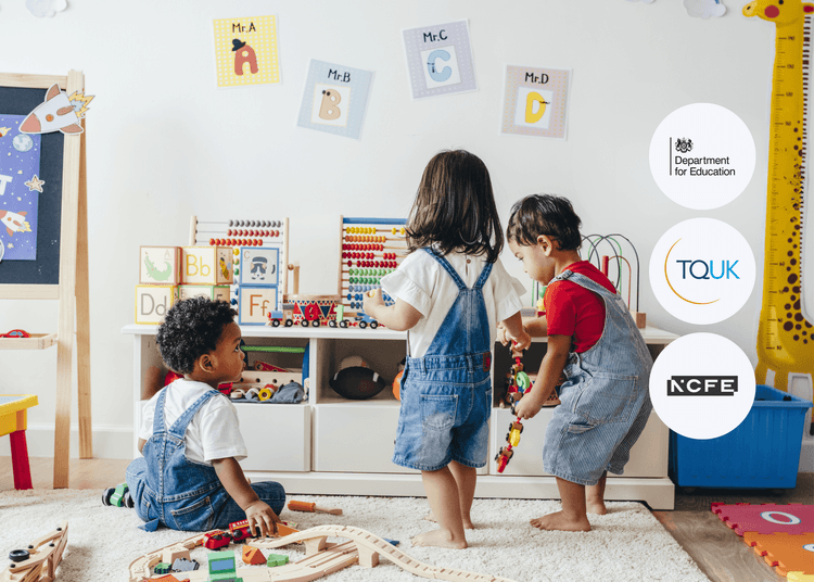Three toddlers play with wooden trains and blocks in a nursery filled with alphabet cards, toys, and early learning displays. Three young children in denim overalls playing with toys and blocks in a bright, colourful nursery classroom.