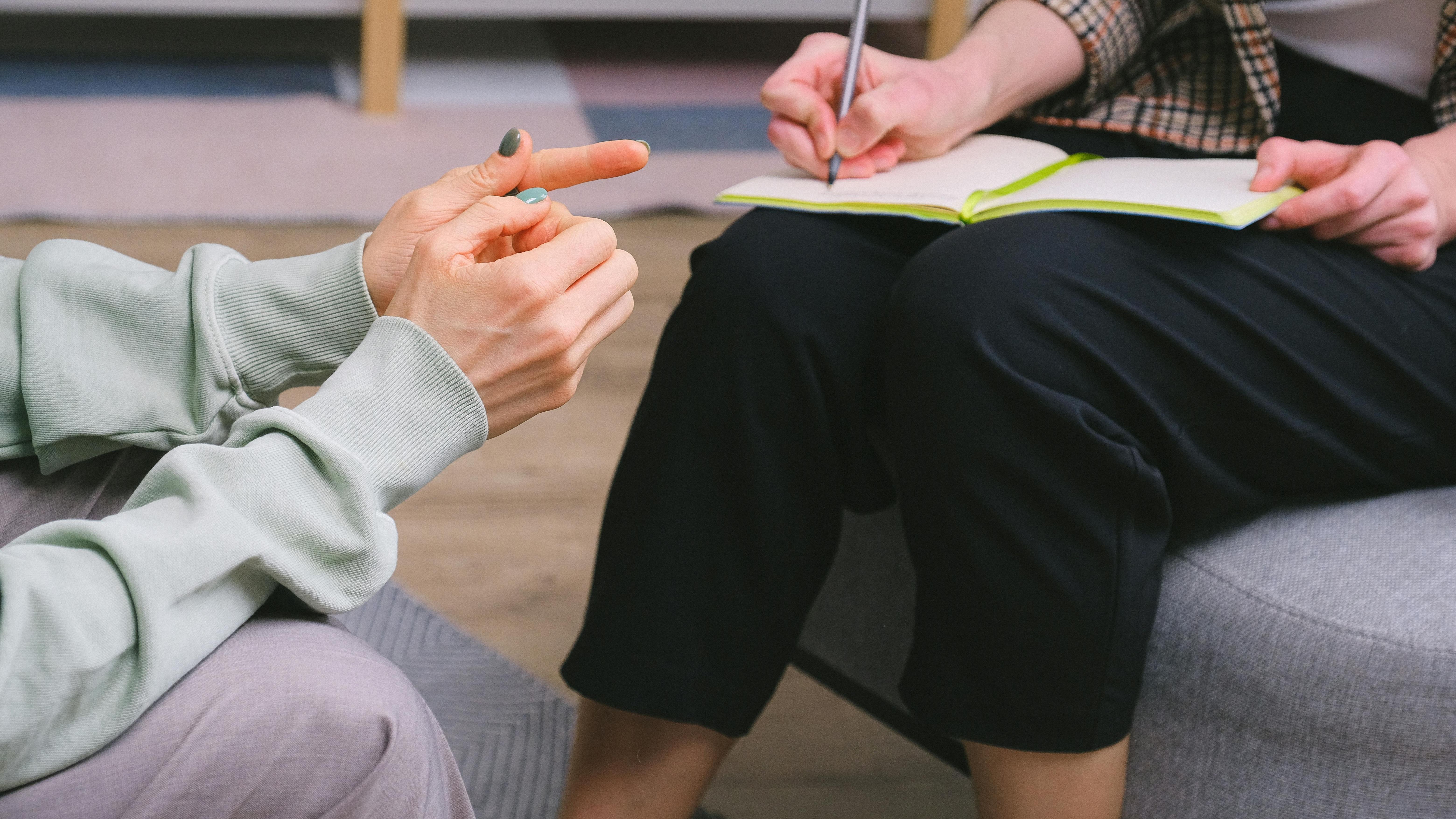 Counsellor providing mental health support to a young adult